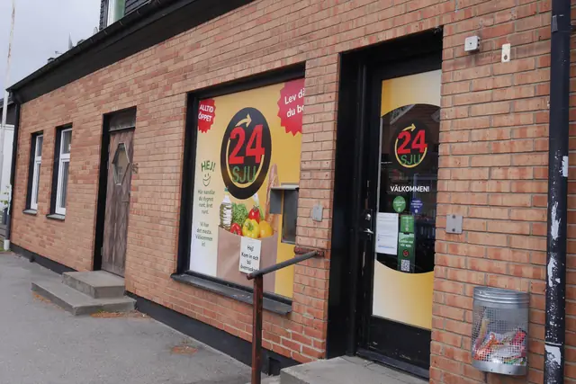 24SJU high-street store in a brick building